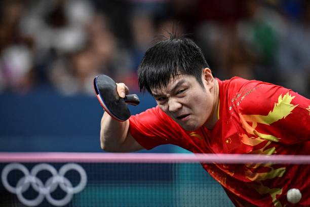 王皓的遗憾与荣耀:奥运金牌梦未竟,精神永存